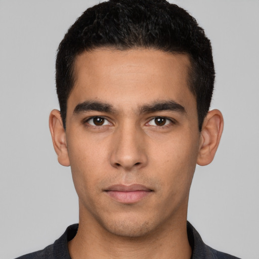 Neutral white young-adult male with short  black hair and brown eyes