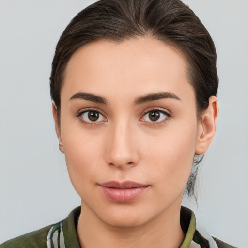 Neutral white young-adult female with medium  brown hair and brown eyes