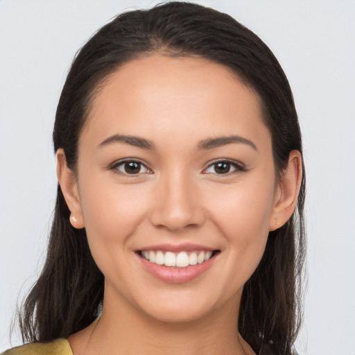 Joyful white young-adult female with long  brown hair and brown eyes