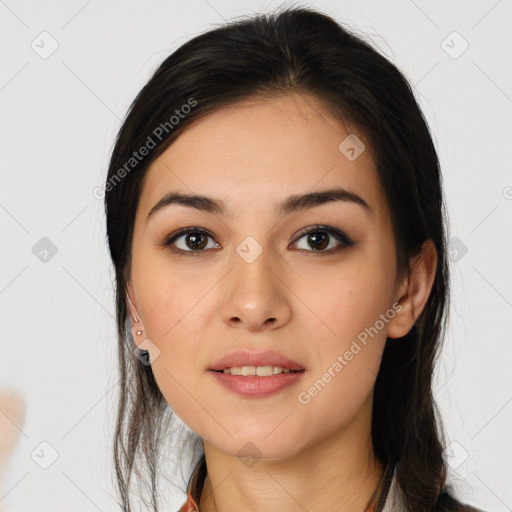 Joyful white young-adult female with long  brown hair and brown eyes