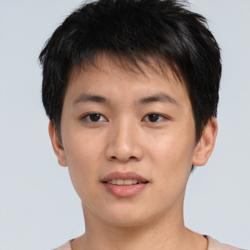 Joyful asian young-adult male with short  brown hair and brown eyes