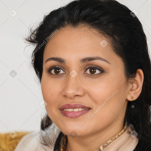 Joyful latino young-adult female with medium  brown hair and brown eyes