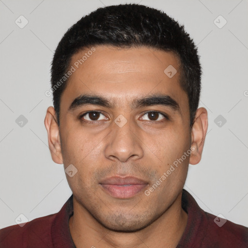 Joyful latino young-adult male with short  black hair and brown eyes