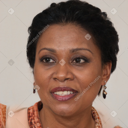 Joyful latino adult female with medium  brown hair and brown eyes