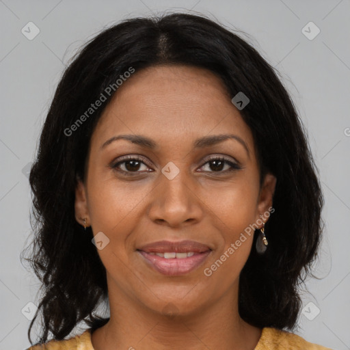 Joyful black young-adult female with long  brown hair and brown eyes