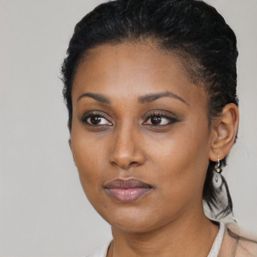 Neutral black young-adult female with medium  brown hair and brown eyes