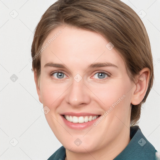 Joyful white young-adult female with medium  brown hair and grey eyes