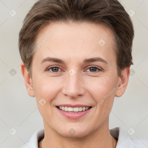 Joyful white young-adult female with short  brown hair and brown eyes