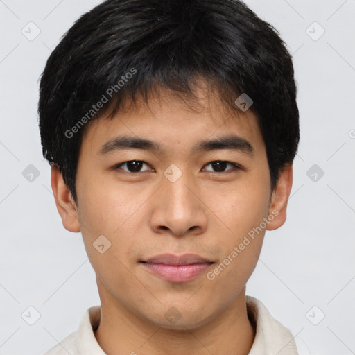 Joyful asian young-adult male with short  brown hair and brown eyes