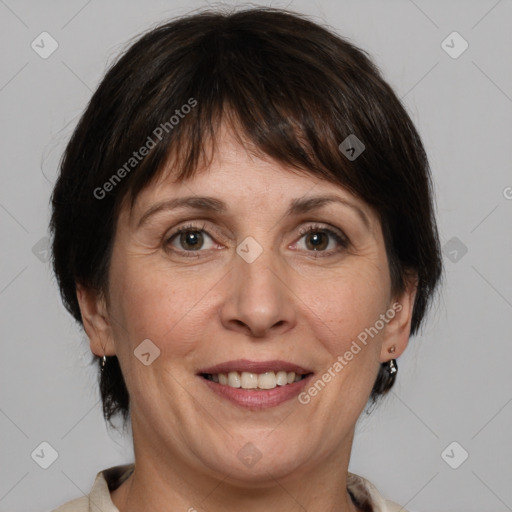 Joyful white adult female with medium  brown hair and grey eyes