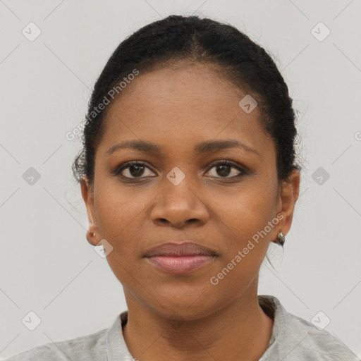 Joyful black young-adult female with short  brown hair and brown eyes