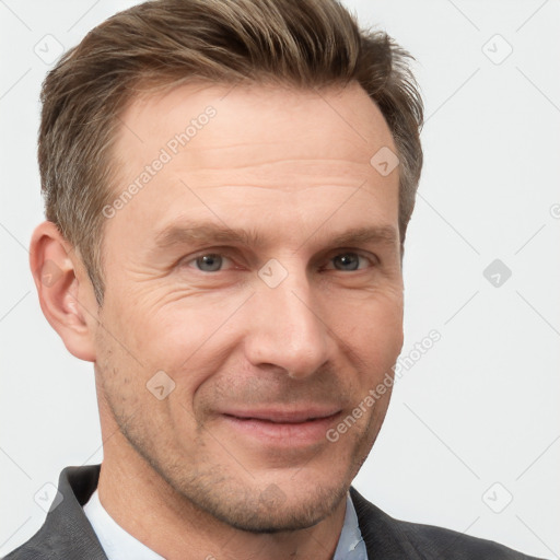 Joyful white adult male with short  brown hair and grey eyes