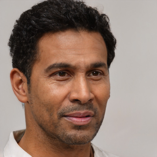 Neutral latino adult male with short  brown hair and brown eyes