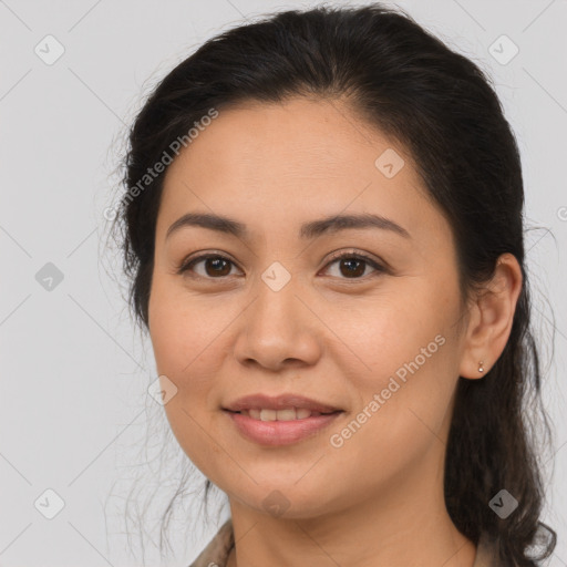 Joyful latino young-adult female with medium  brown hair and brown eyes