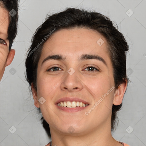 Joyful white young-adult female with medium  brown hair and brown eyes