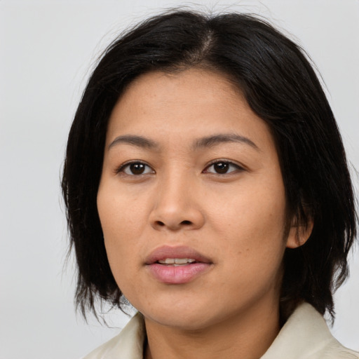 Neutral asian young-adult female with medium  black hair and brown eyes