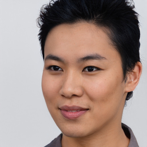 Joyful asian young-adult female with medium  black hair and brown eyes