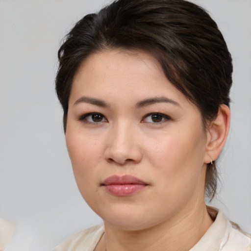 Joyful white young-adult female with medium  brown hair and brown eyes