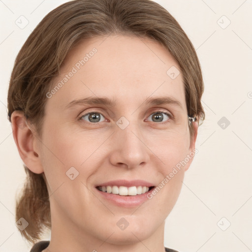 Joyful white young-adult female with medium  brown hair and grey eyes