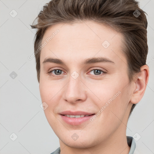 Joyful white young-adult female with short  brown hair and grey eyes