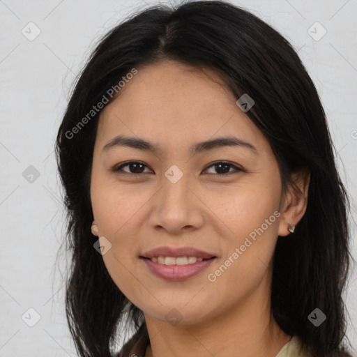 Joyful asian young-adult female with long  brown hair and brown eyes