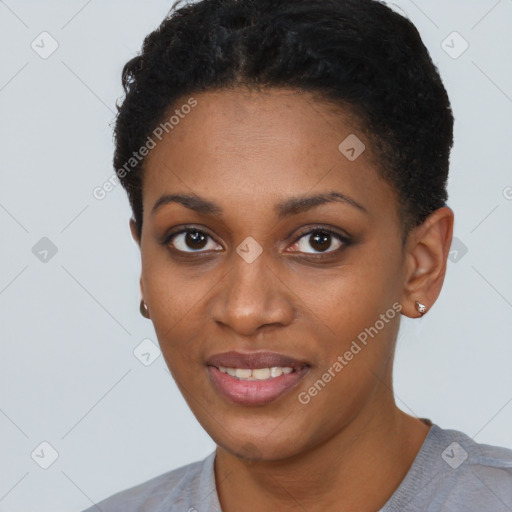 Joyful black young-adult female with short  brown hair and brown eyes