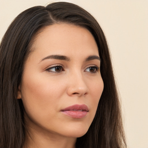 Neutral white young-adult female with long  brown hair and brown eyes