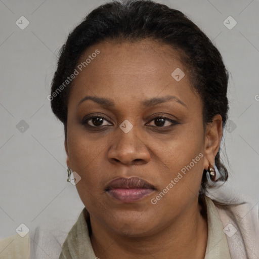 Joyful black adult female with short  brown hair and brown eyes