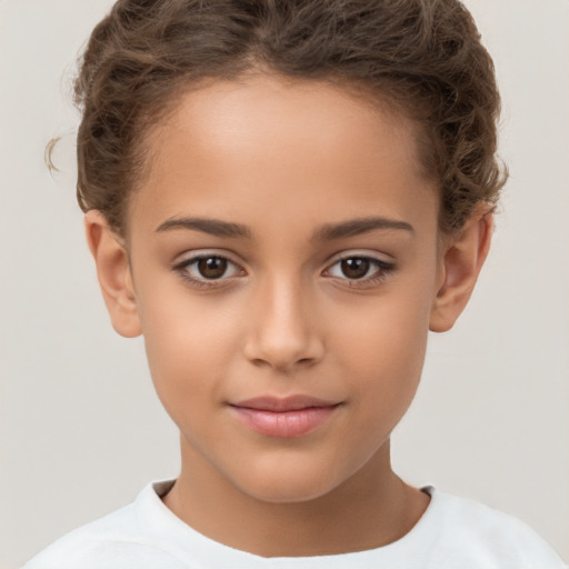 Joyful white child female with short  brown hair and brown eyes