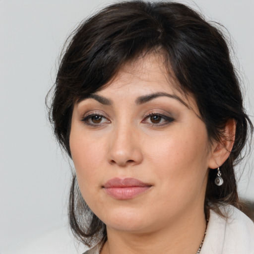 Neutral asian young-adult female with medium  brown hair and brown eyes