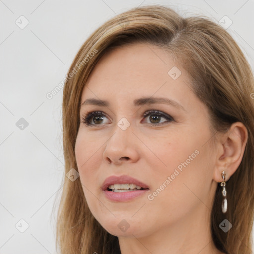 Joyful white young-adult female with long  brown hair and brown eyes