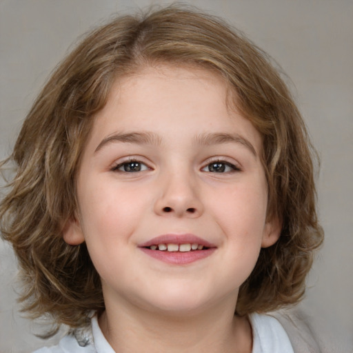 Joyful white child female with medium  brown hair and blue eyes