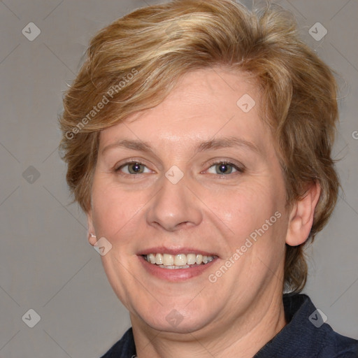 Joyful white adult female with medium  brown hair and blue eyes