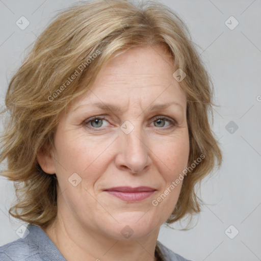 Joyful white adult female with medium  brown hair and blue eyes