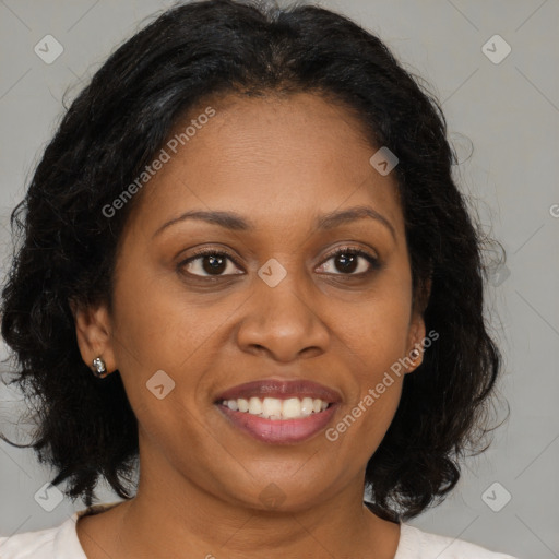 Joyful black adult female with medium  brown hair and brown eyes