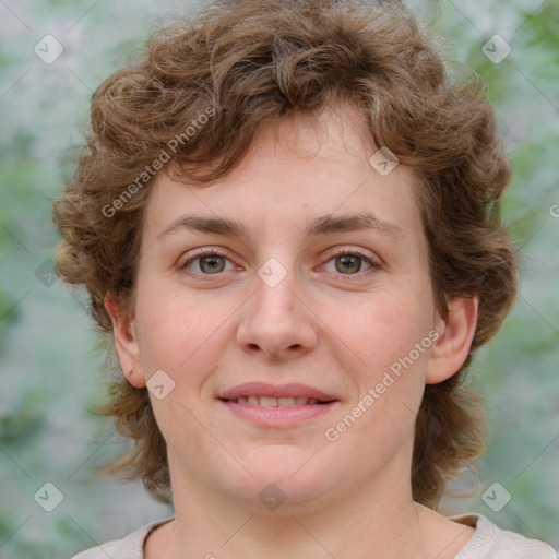 Joyful white young-adult female with medium  brown hair and green eyes