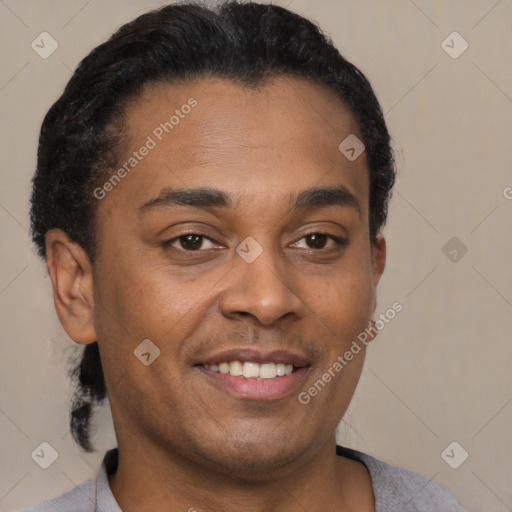 Joyful latino young-adult male with short  brown hair and brown eyes