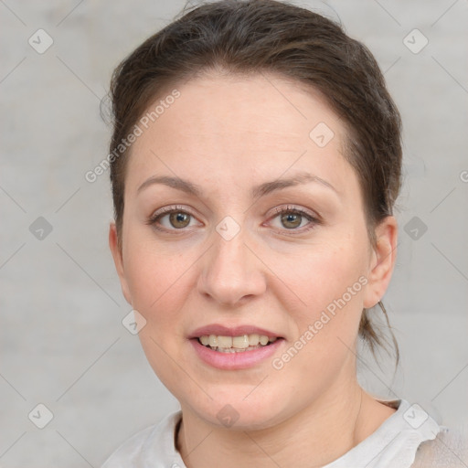 Joyful white adult female with short  brown hair and grey eyes