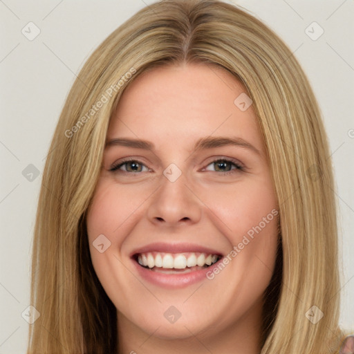 Joyful white young-adult female with long  brown hair and green eyes