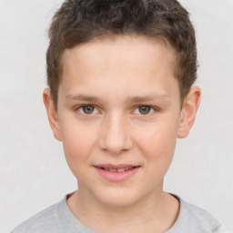 Joyful white child male with short  brown hair and brown eyes