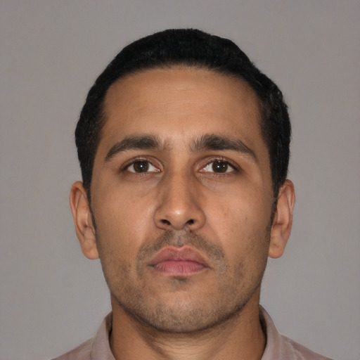 Neutral latino adult male with short  black hair and brown eyes