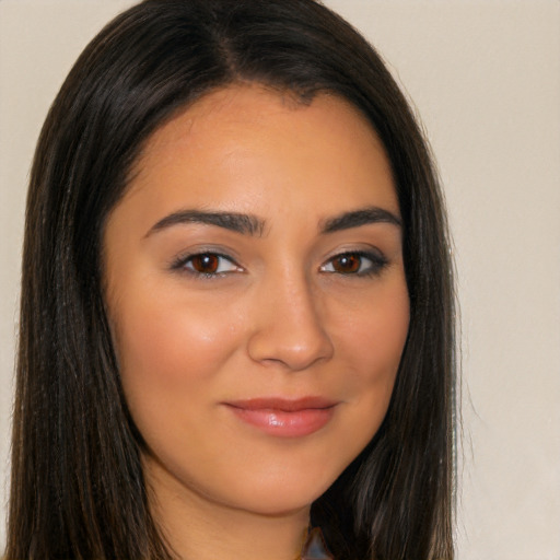 Joyful latino young-adult female with long  brown hair and brown eyes