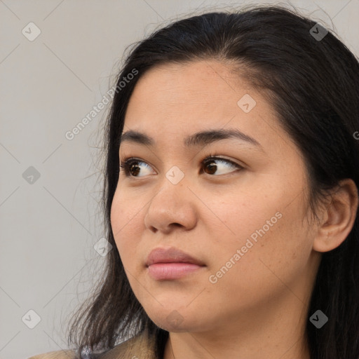 Neutral white young-adult female with long  brown hair and brown eyes