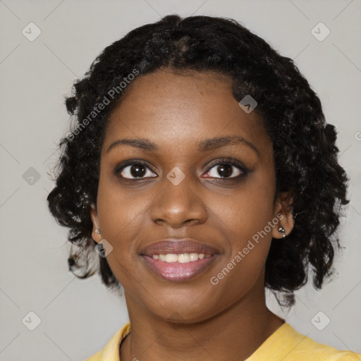 Joyful black young-adult female with medium  black hair and brown eyes