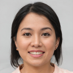 Joyful white young-adult female with medium  brown hair and brown eyes