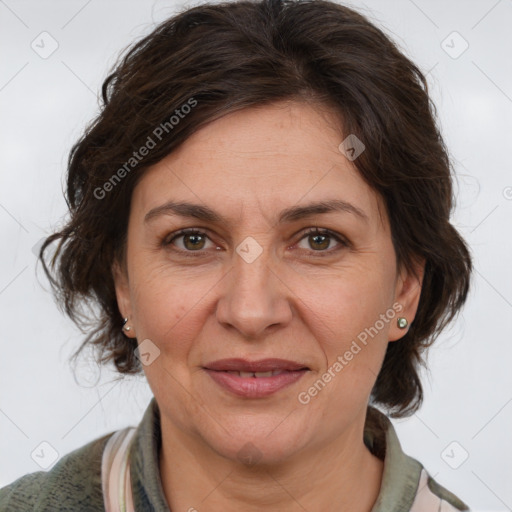 Joyful white adult female with medium  brown hair and grey eyes