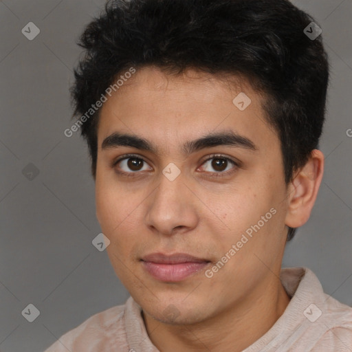 Joyful latino young-adult male with short  brown hair and brown eyes