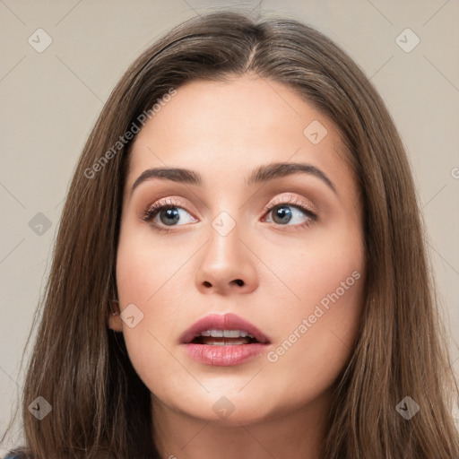 Neutral white young-adult female with long  brown hair and brown eyes