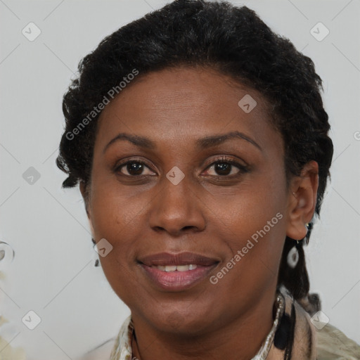 Joyful black adult female with short  brown hair and brown eyes