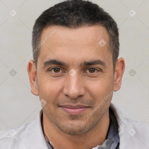 Joyful white adult male with short  brown hair and brown eyes